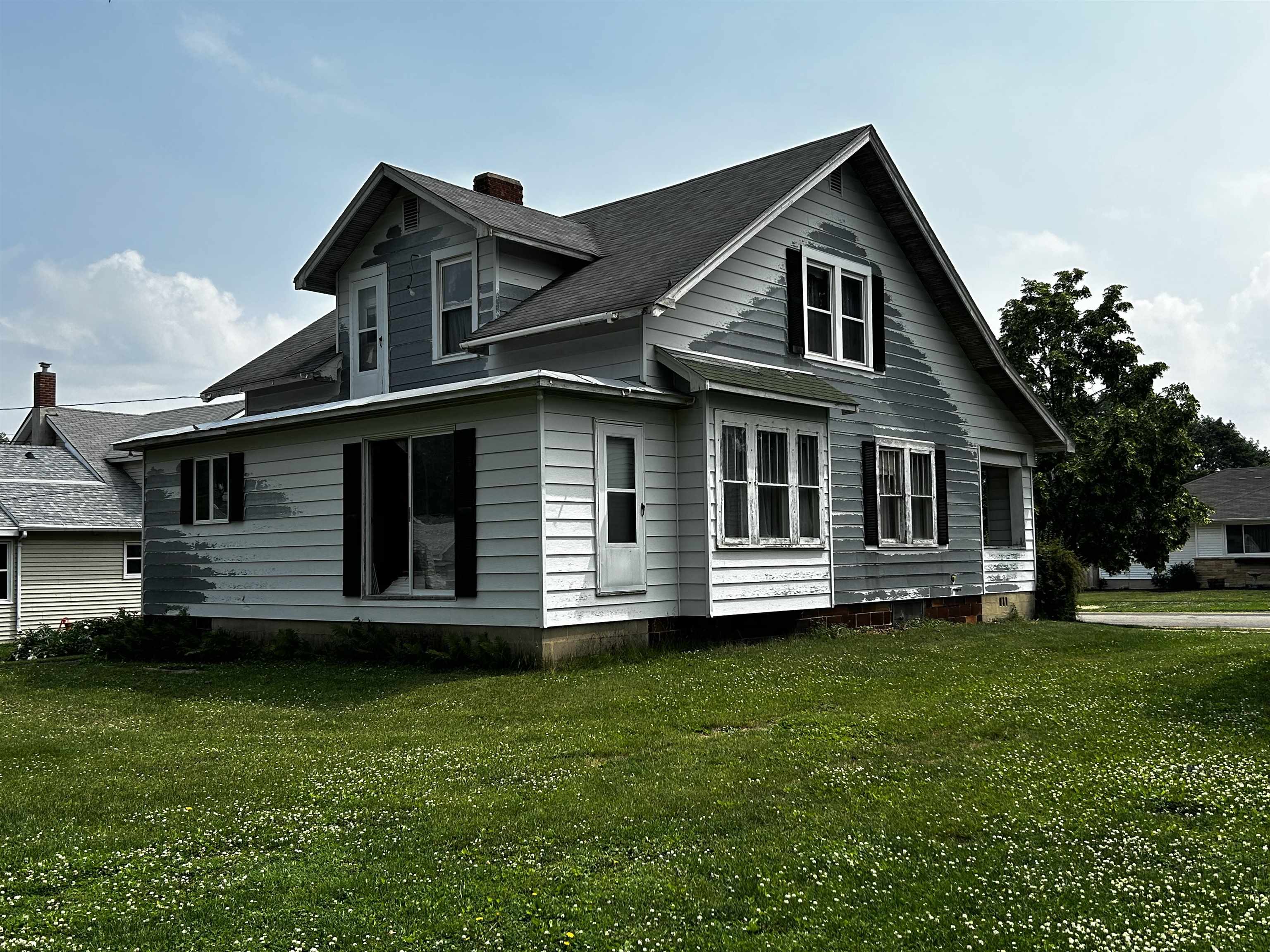 106 3rd Avenue Forreston, IL 61030 - Photo 16 of 18 a front view of a house with a garden