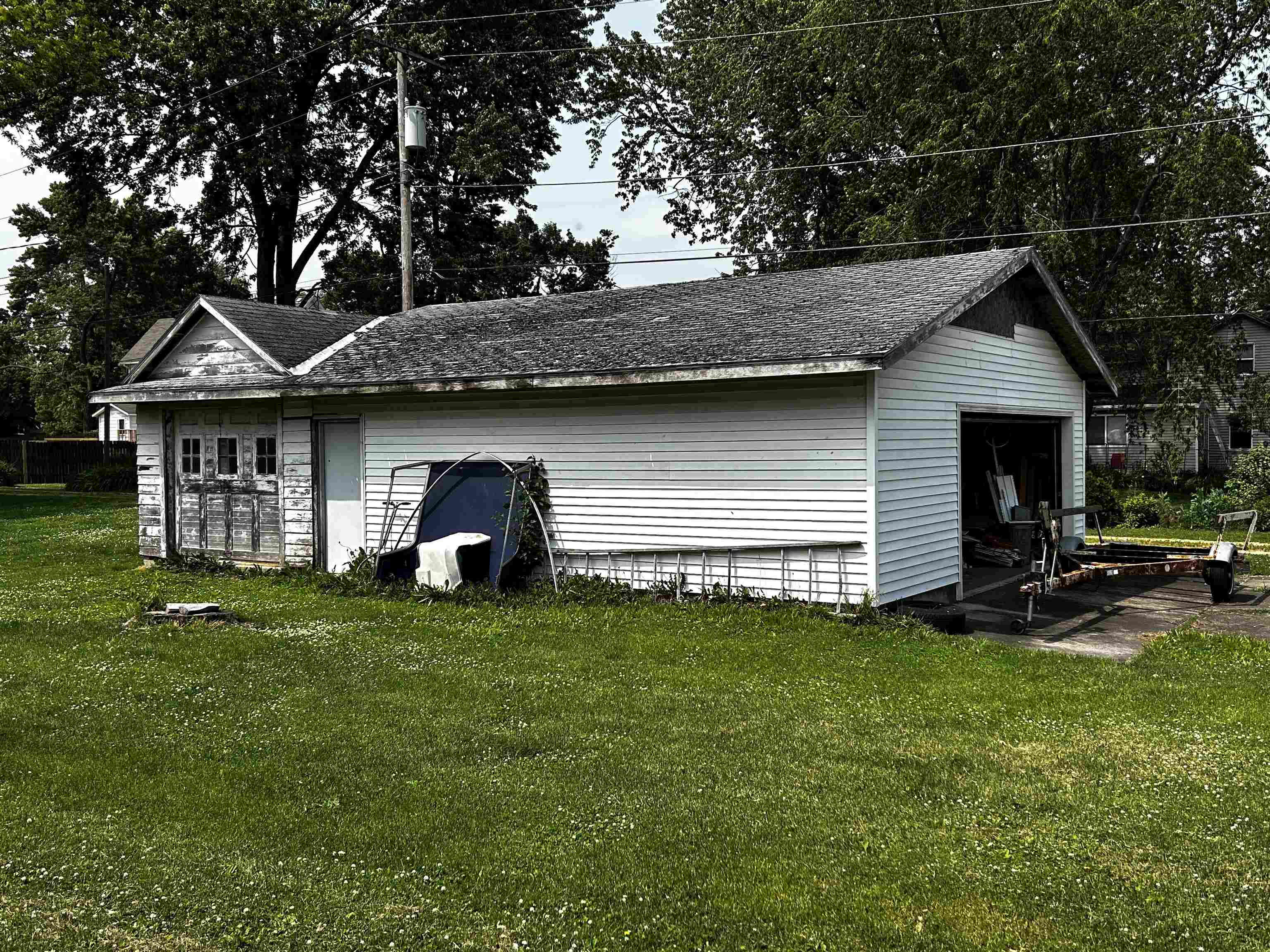106 3rd Avenue Forreston, IL 61030 - Photo 18 of 18 a view of a backyard with table and chairs and a fire pit