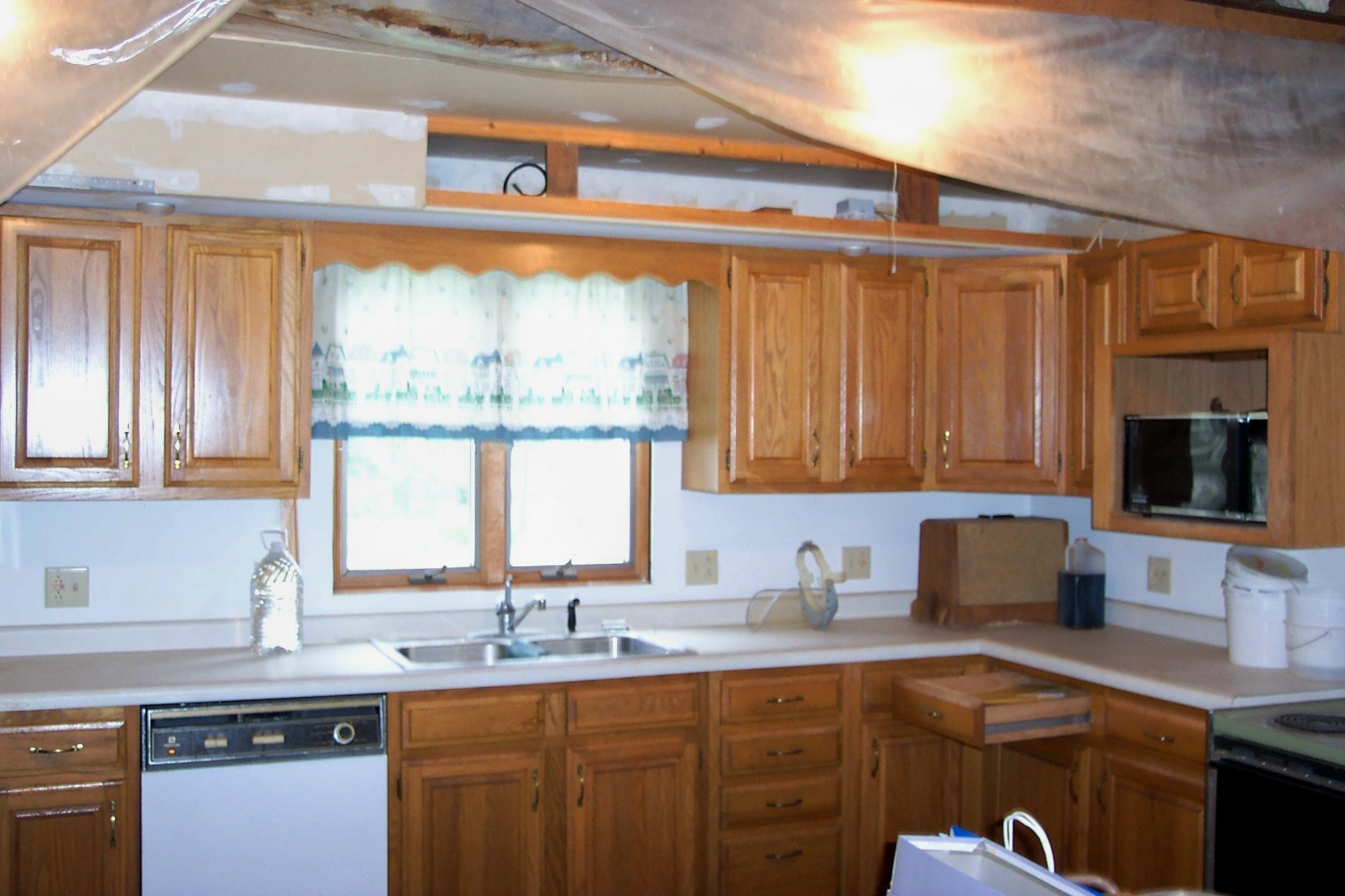 106 3rd Avenue Forreston, IL 61030 - Photo 2 of 18 a kitchen with granite countertop a sink and a window