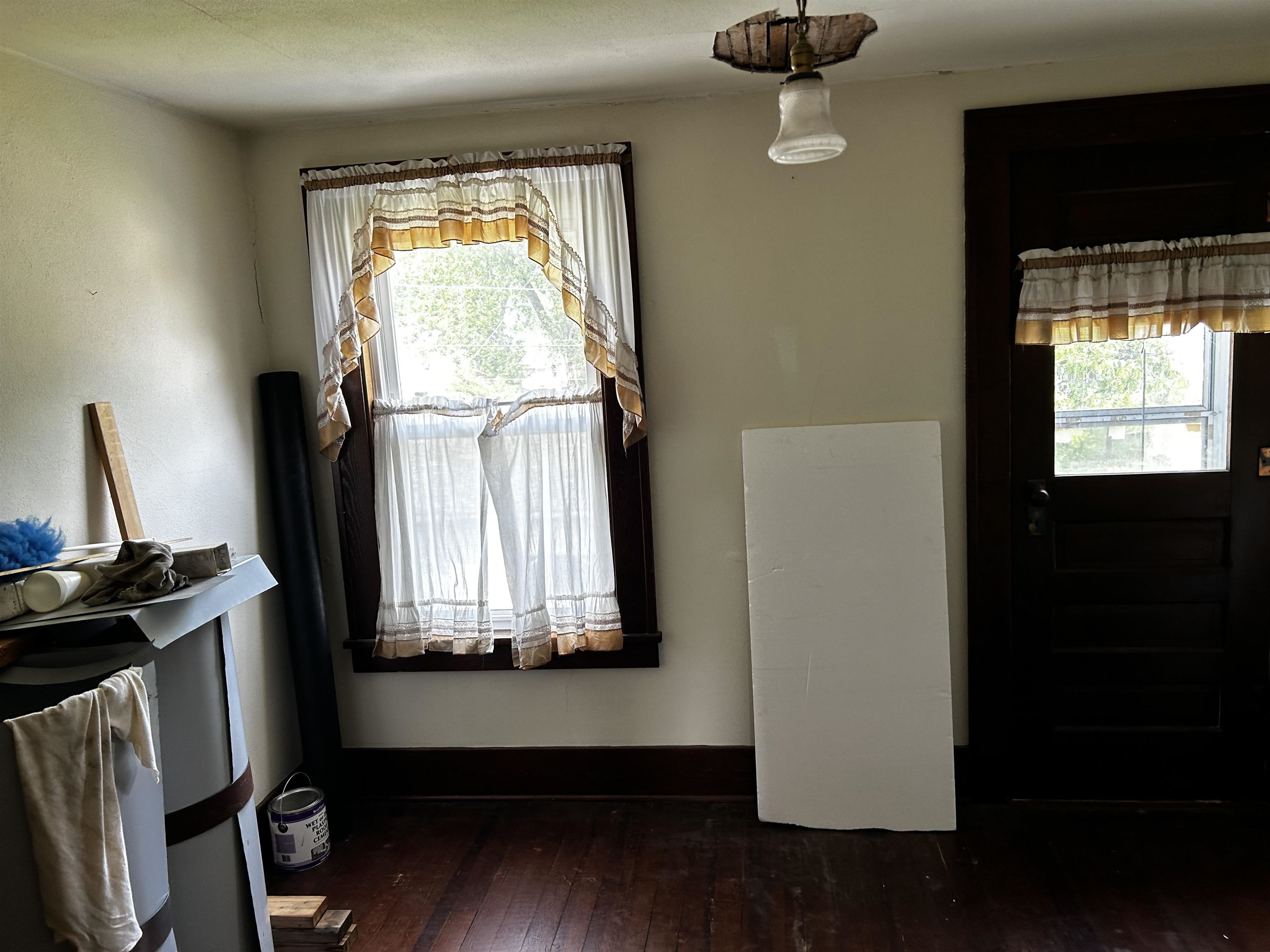 106 3rd Avenue Forreston, IL 61030 - Photo 8 of 18 a view of room with wooden floor and windows