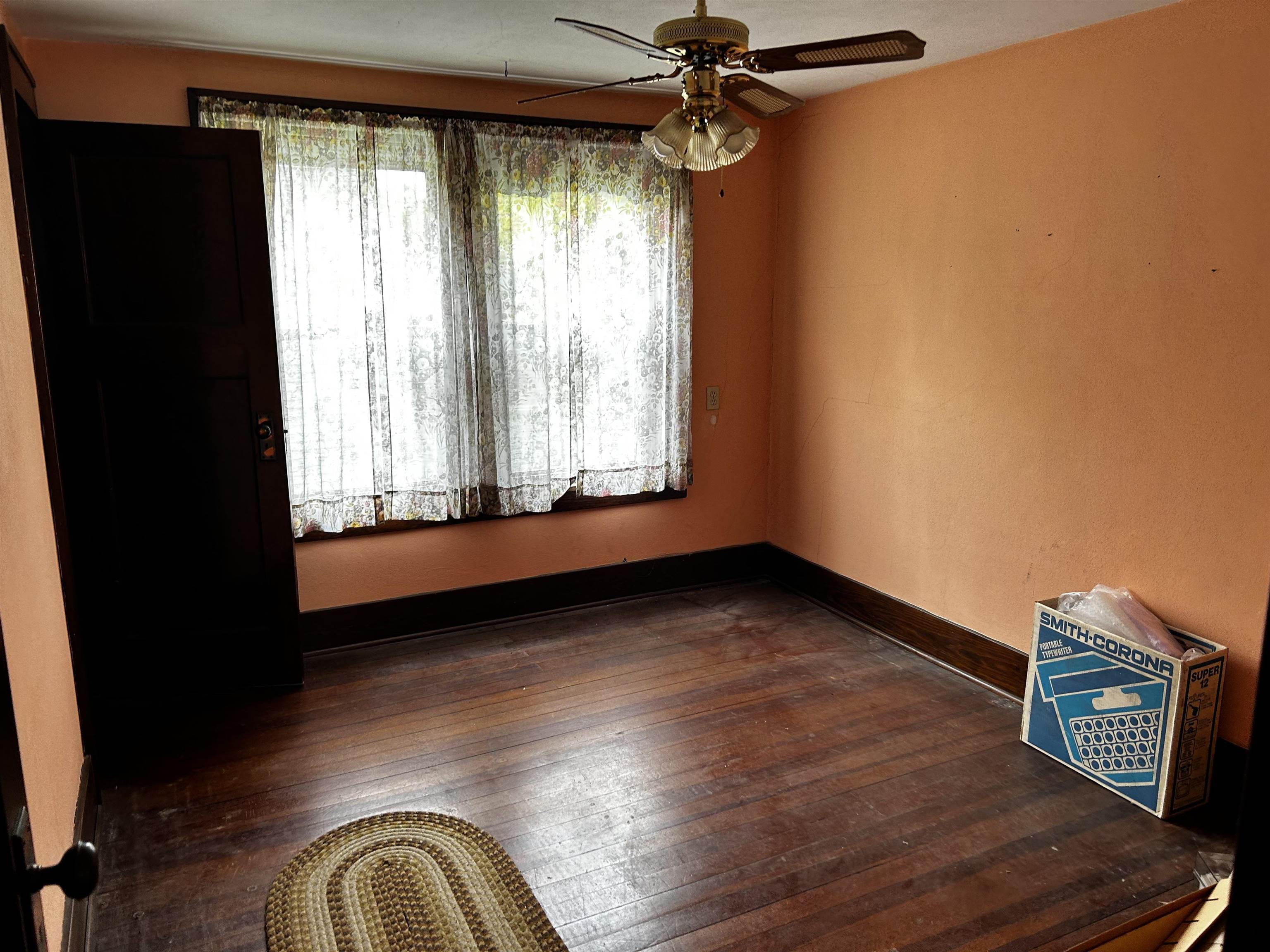 106 3rd Avenue Forreston, IL 61030 - Photo 9 of 18 a view of an empty room with a window and wooden floor
