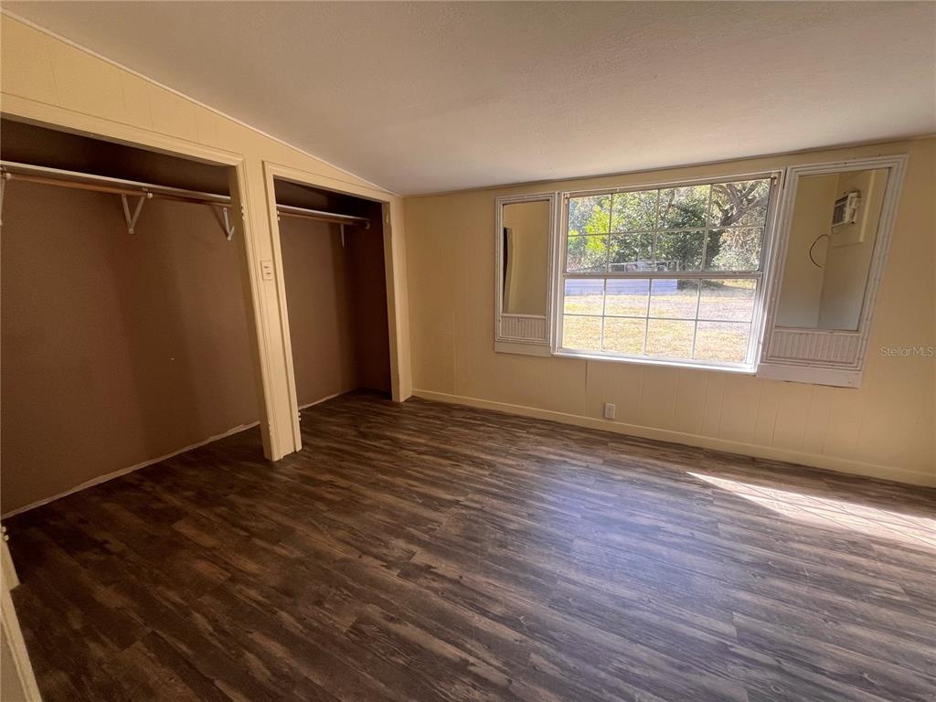 230 South Center Street Pierson, FL 32180 - Photo 27 of 27 a view of an empty room with wooden floor and a window