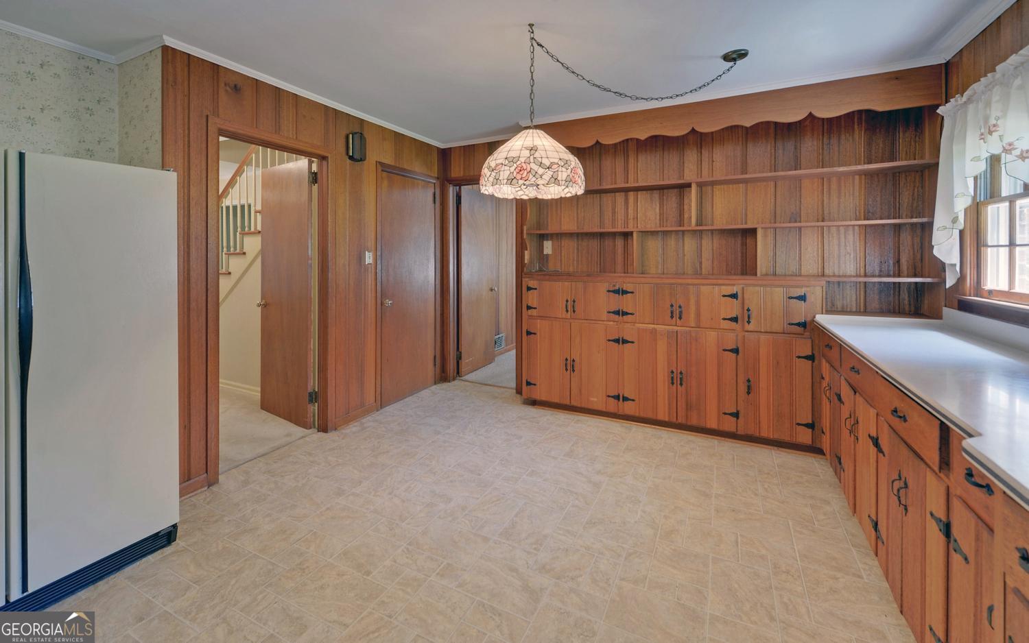 400 Harris Street Toccoa, GA 30577 - Photo 10 of 49 a view of a kitchen with cabinets and wooden floor