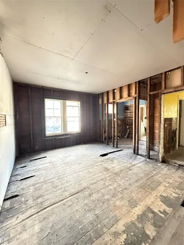 a view of a room with wooden furniture