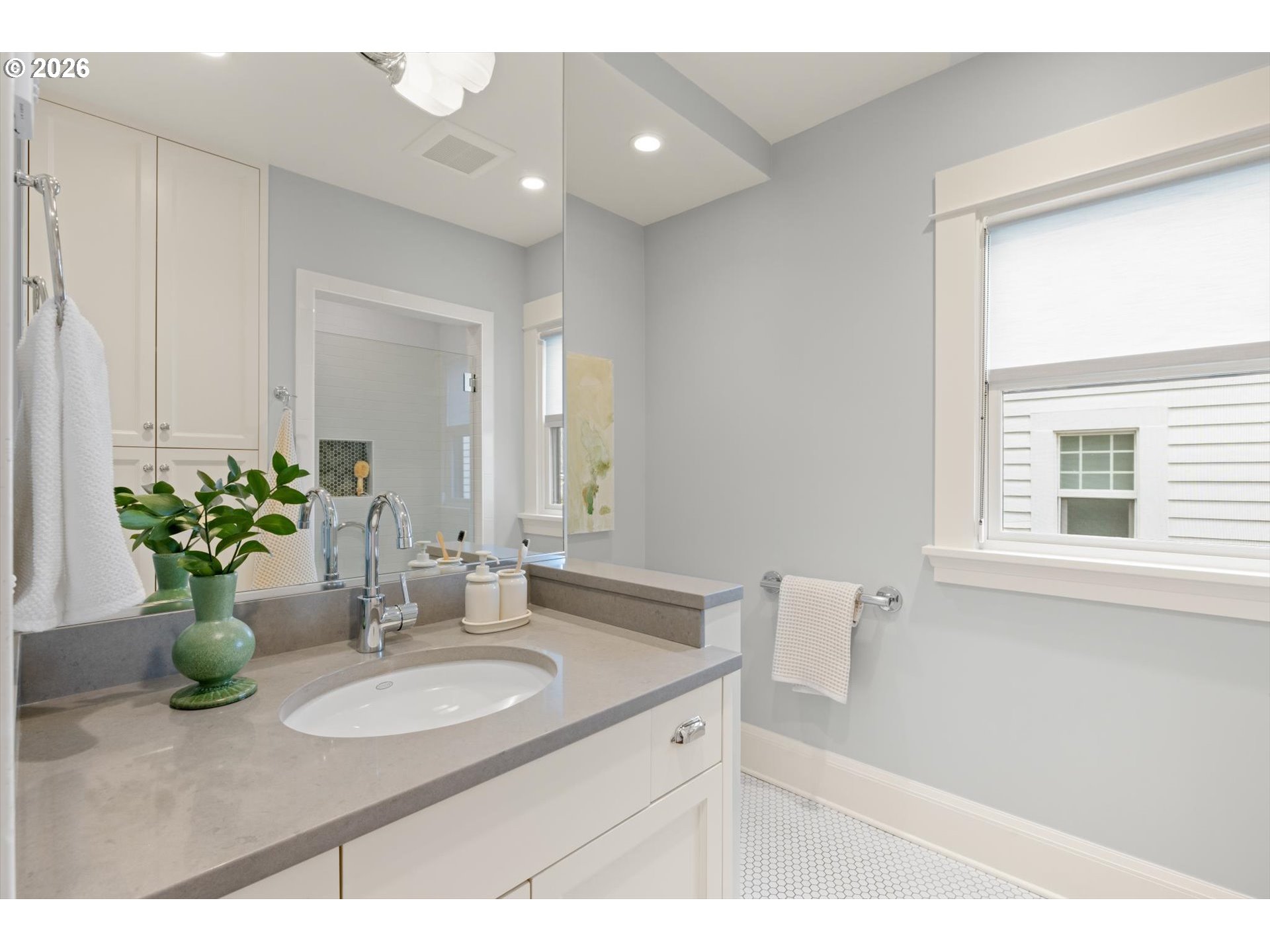 3431 Northeast Alameda Street Portland, OR 97212 - Photo 14 of 37 a bathroom with a granite countertop sink a large mirror and a window