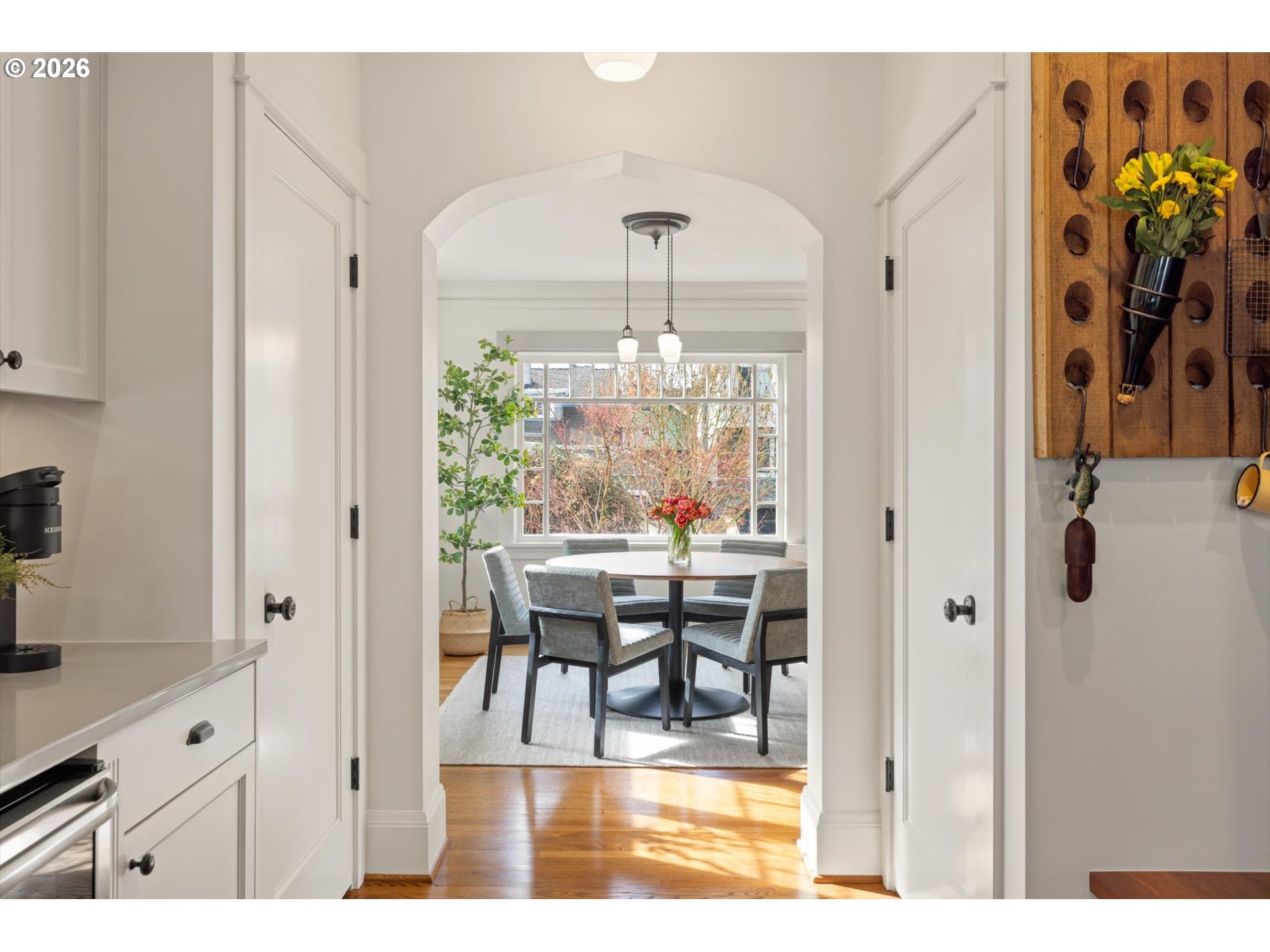 3431 Northeast Alameda Street Portland, OR 97212 - Photo 10 of 37 a view of a dining room with furniture a chandelier and wooden floor