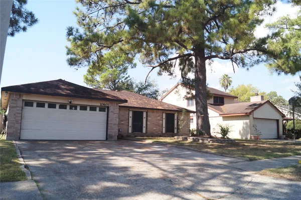 a view of a house with a tree