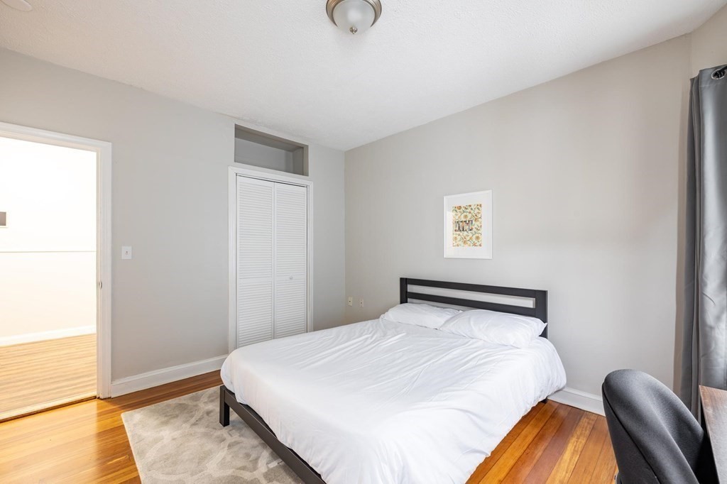 17 Cawfield Street, Unit 2 Boston, MA 02125 - Photo 5 of 14 a bedroom with a bed and window