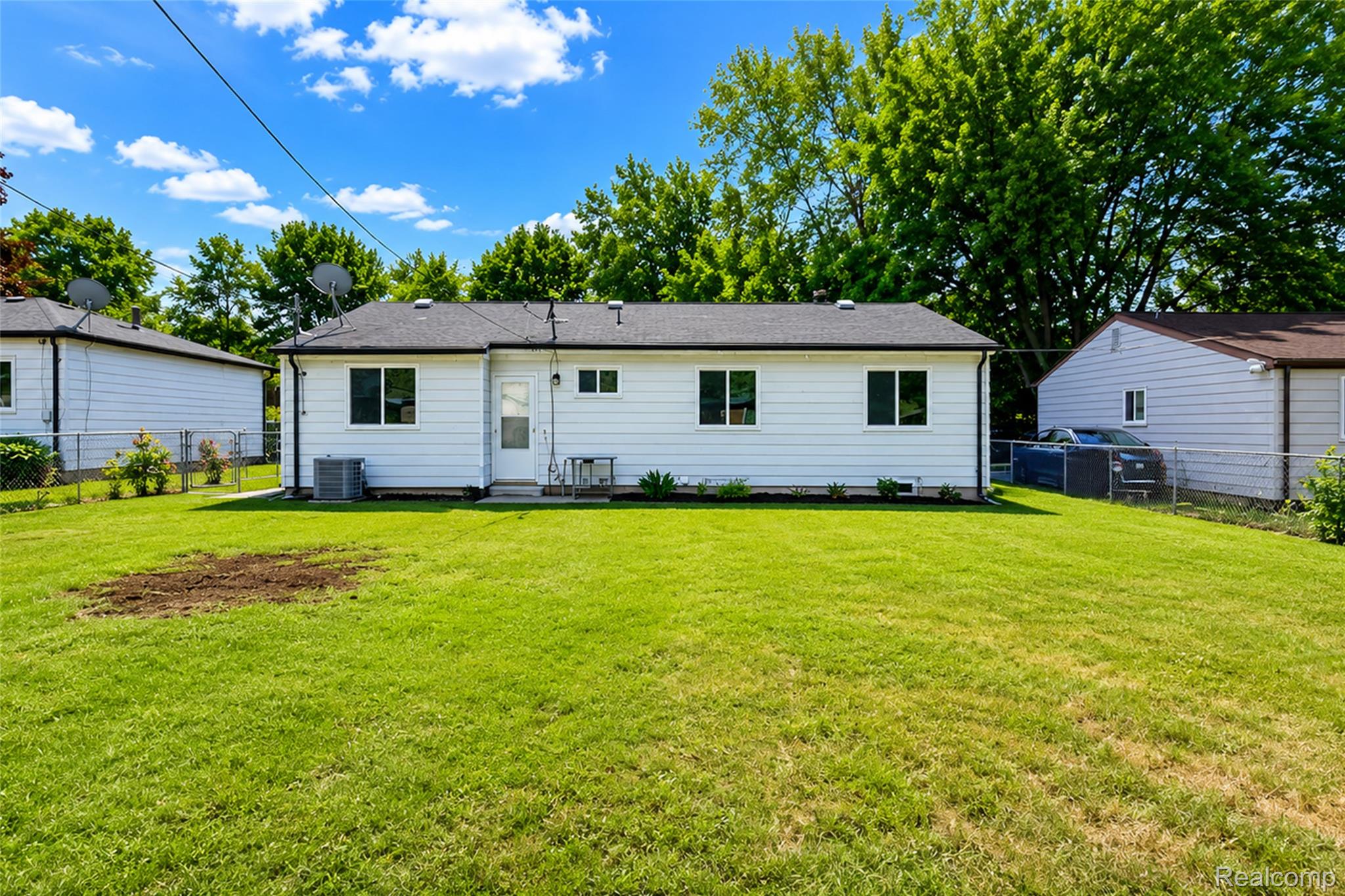 201 Cardwell Street Inkster, MI 48141 - Photo 6 of 41 Expansive green lawn with mature trees bordering the property