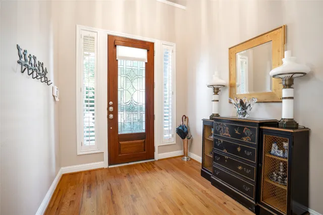 a view of dresser with window and wooden floor
