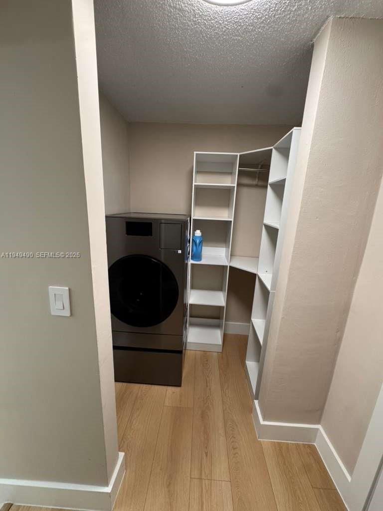 1990 West 56th Street, Unit 1311 Hialeah, FL 33012 - Photo 6 of 14 a view of walk in closet with empty racks