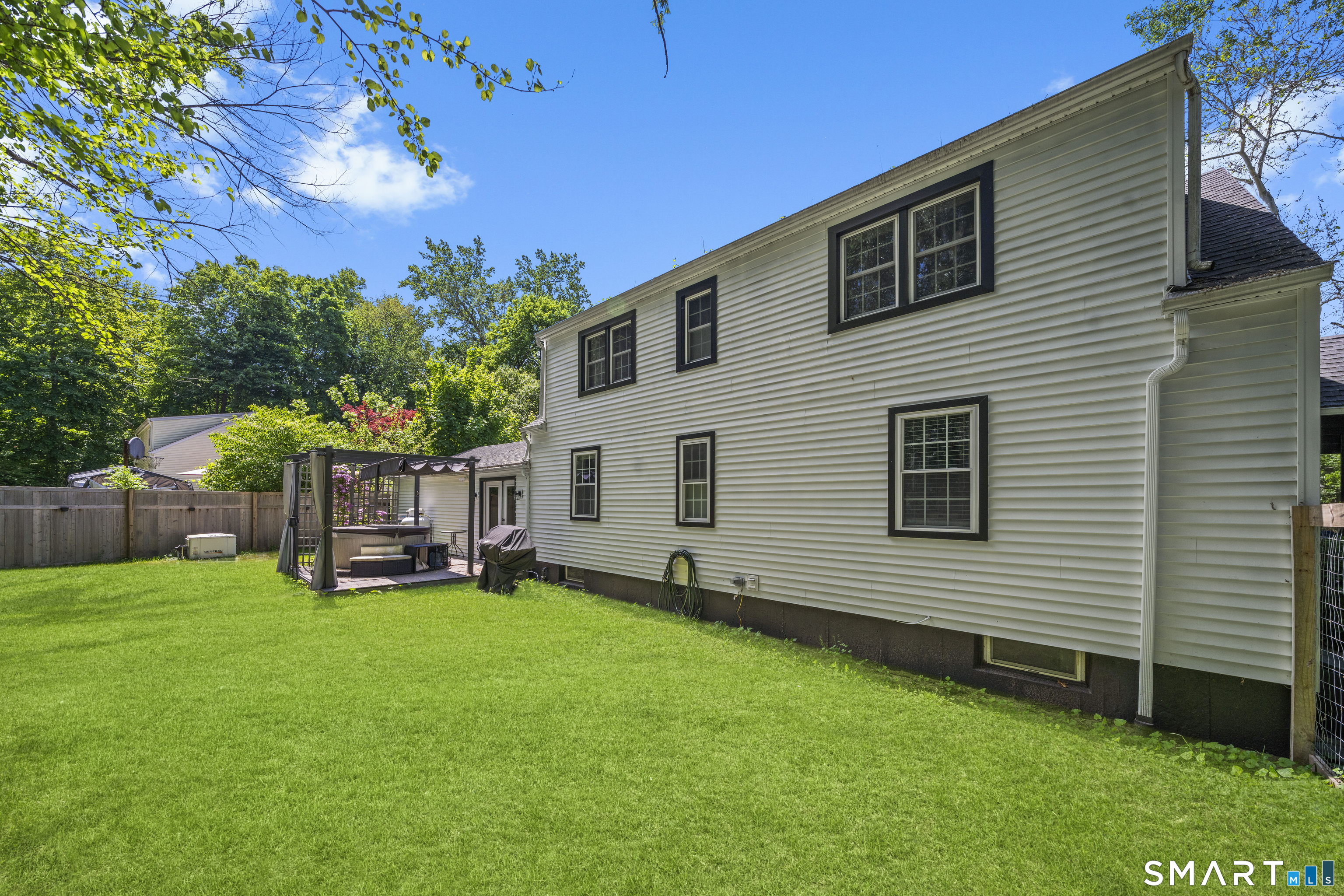 211 Whisconier Road Brookfield, CT 06804 - Photo 36 of 38 a view of a house with a yard and sitting area