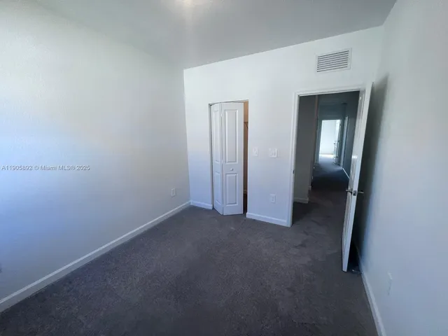 a view of hallway with closet