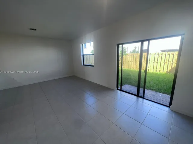 a view of an empty room and window