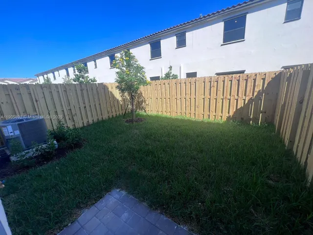 a view of a backyard with plants