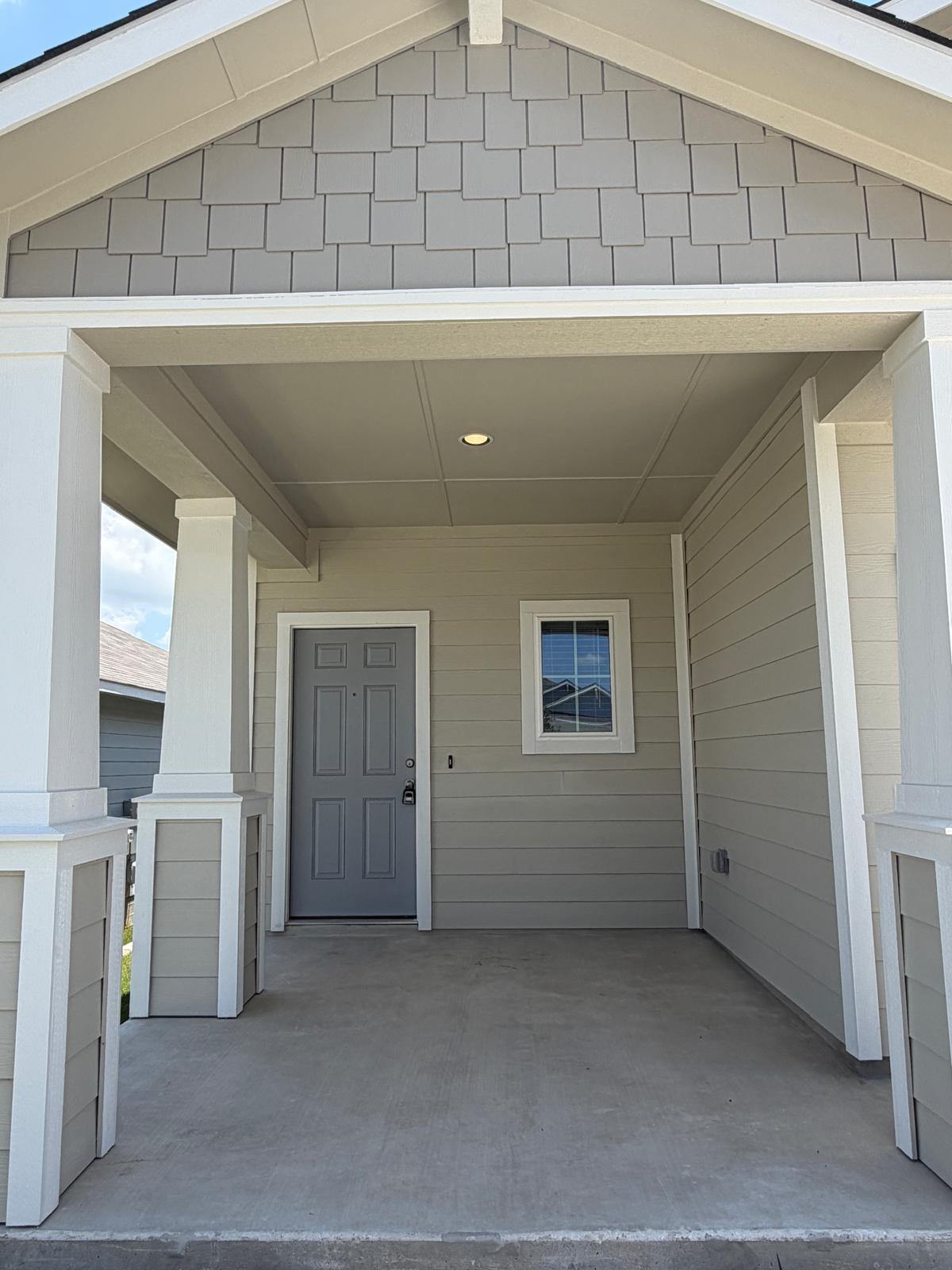 2701 Towy Road Manor, TX 78653 - Photo 4 of 35 A welcoming front porch features sturdy columns and a gabled roofline.