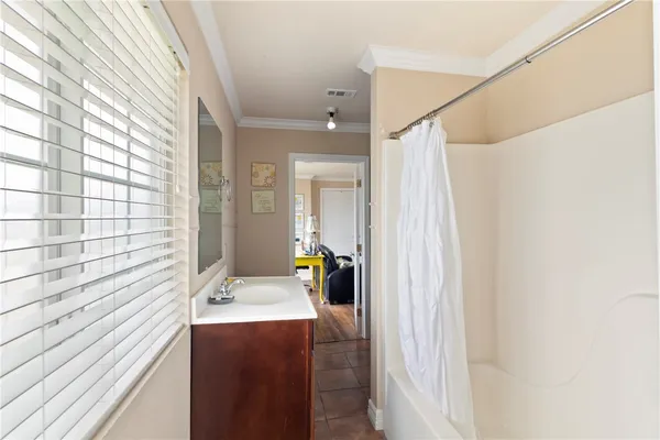 a en suite bathroom with a sink and mirror