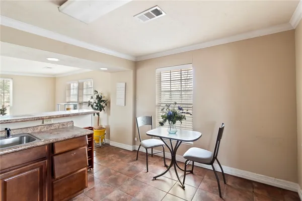 a view of a kitchen and dining room