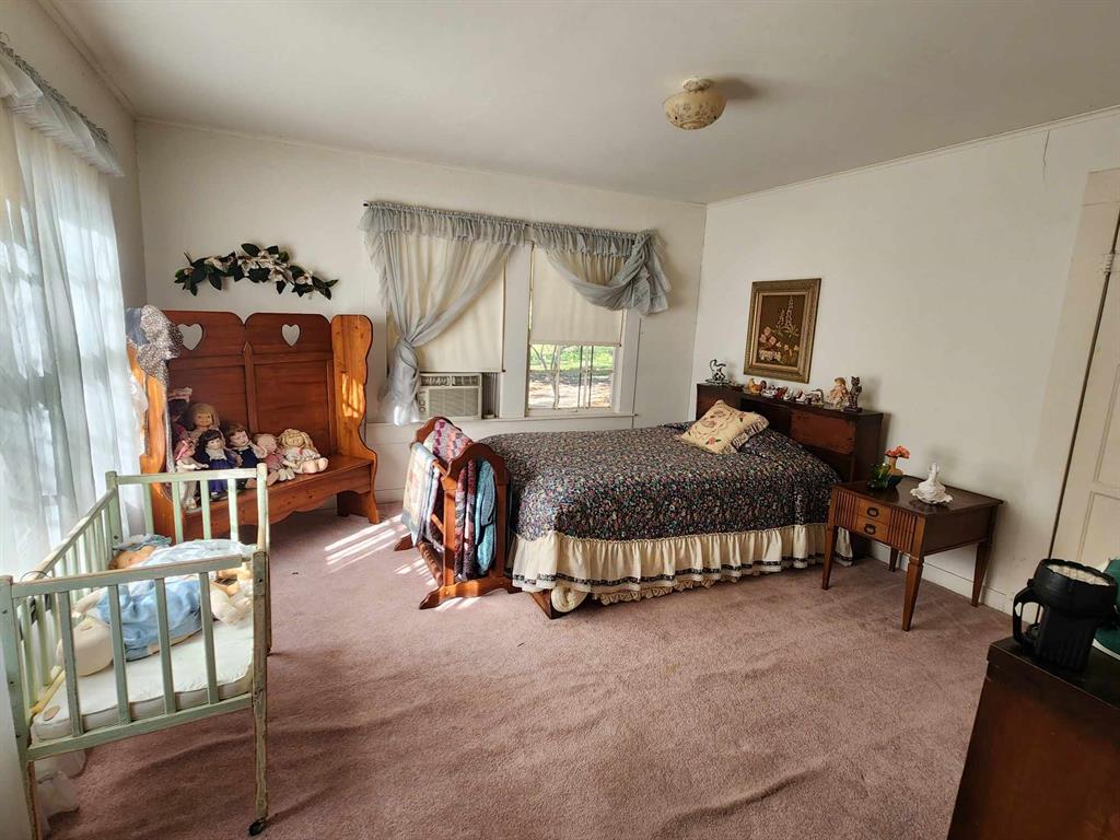 14816 Highway 84 Logansport, LA 71049 - Photo 11 of 21 a bedroom with bed and window