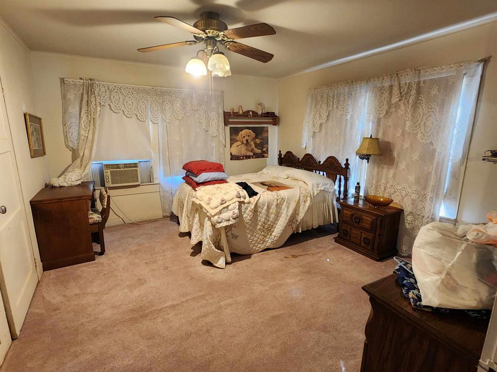 14816 Highway 84 Logansport, LA 71049 - Photo 12 of 21 a bedroom with a bed and furniture