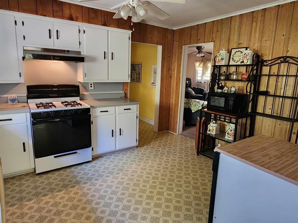 14816 Highway 84 Logansport, LA 71049 - Photo 16 of 21 a kitchen with stainless steel appliances granite countertop a refrigerator a stove and a sink