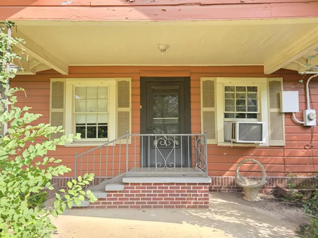 a front view of a house with a outdoor space