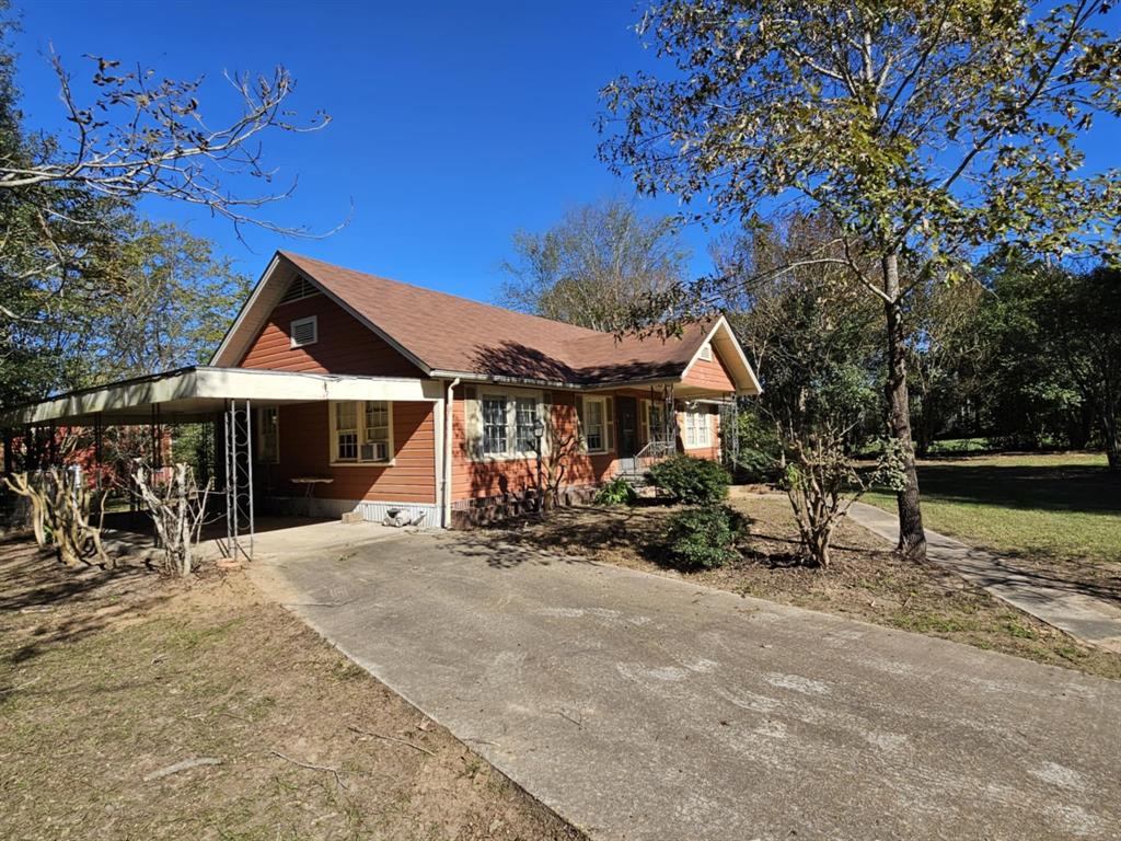 14816 Highway 84 Logansport, LA 71049 - Photo 7 of 21 a view of a house with large trees and sitting area