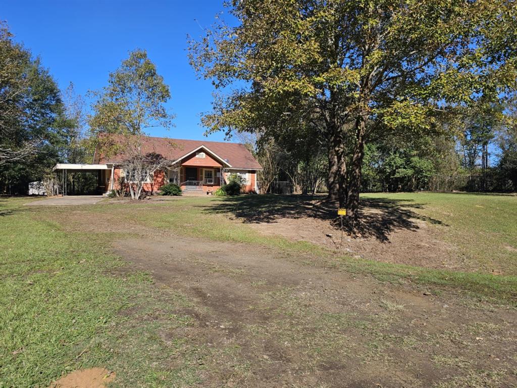 14816 Highway 84 Logansport, LA 71049 - Photo 9 of 21 a view of a town with large trees