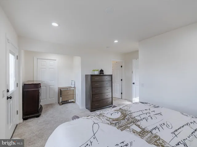 a bedroom with a bed and furniture