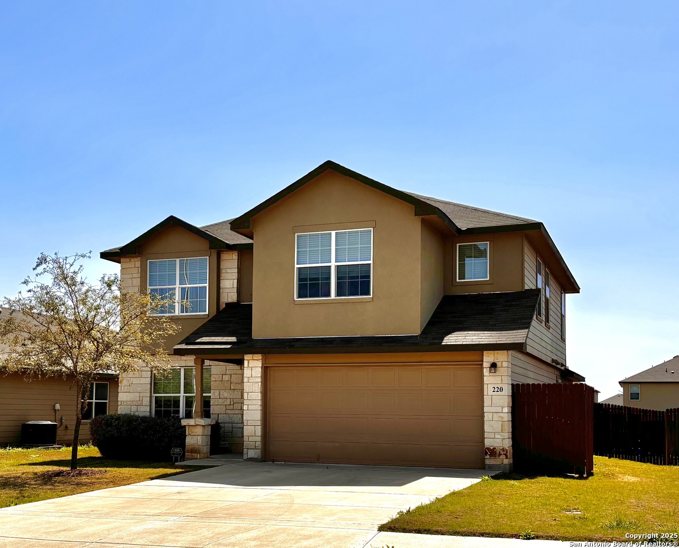 a front view of a house with yard