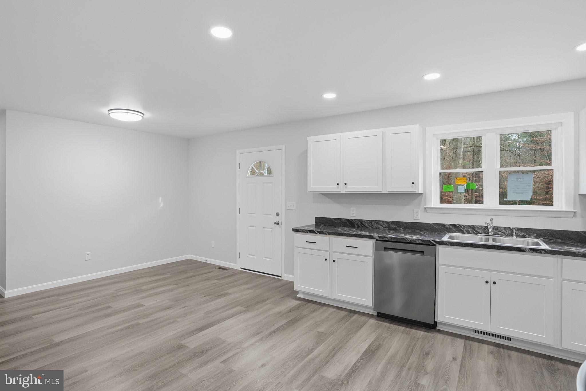 897 Horsepen Road Felton, DE 19943 - Photo 20 of 38 a kitchen with granite countertop a stove and a sink