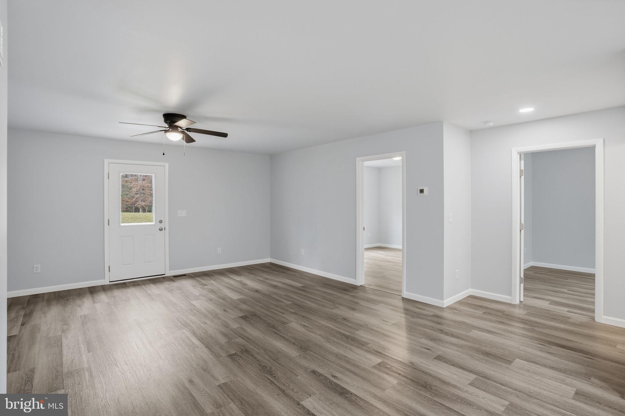 897 Horsepen Road Felton, DE 19943 - Photo 23 of 38 a view of an empty room with wooden floor