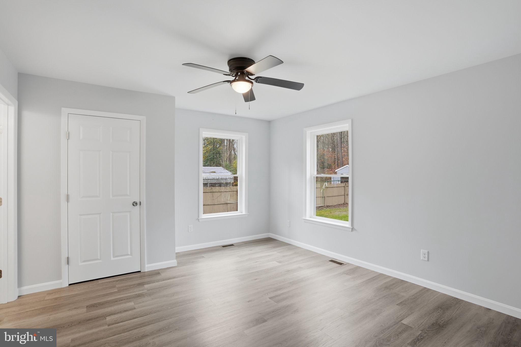 897 Horsepen Road Felton, DE 19943 - Photo 35 of 38 a view of an empty room with a window and wooden floor