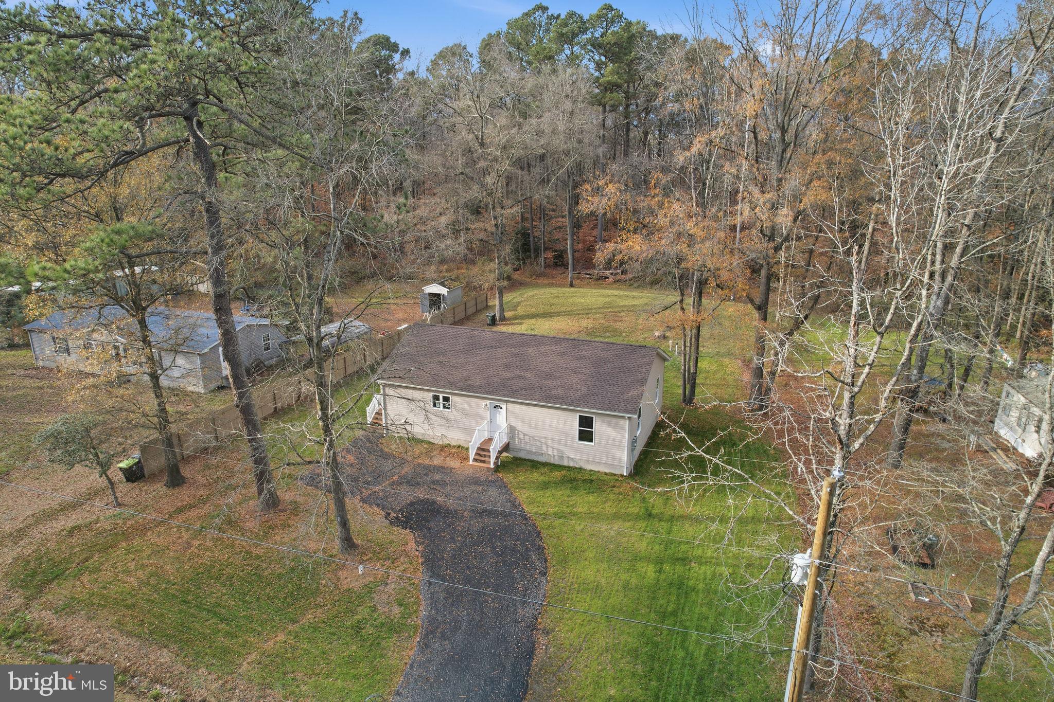 897 Horsepen Road Felton, DE 19943 - Photo 4 of 38 a aerial view of a house with a yard basket ball court and outdoor seating