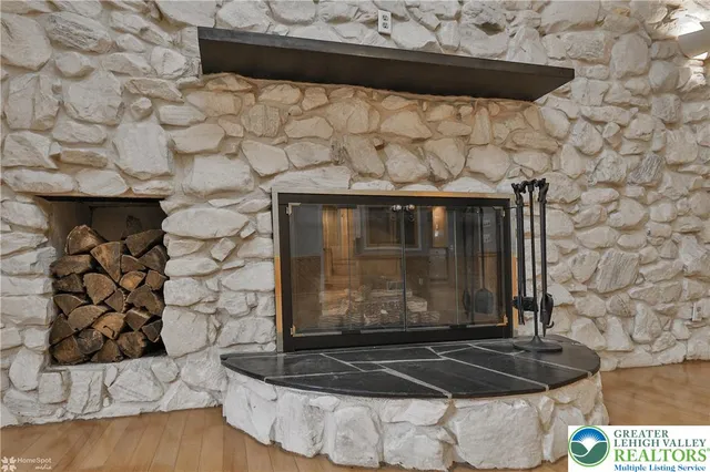 a view of a fireplace with wooden floor