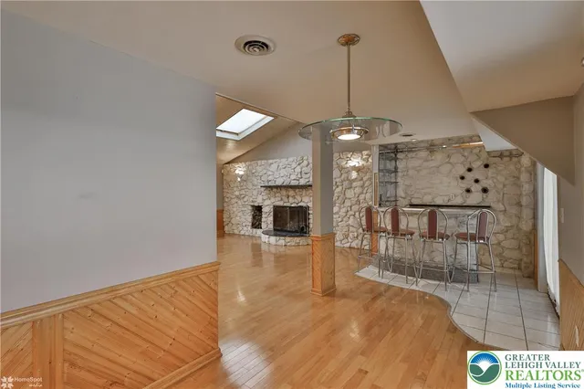 a view of a room window and wooden floor