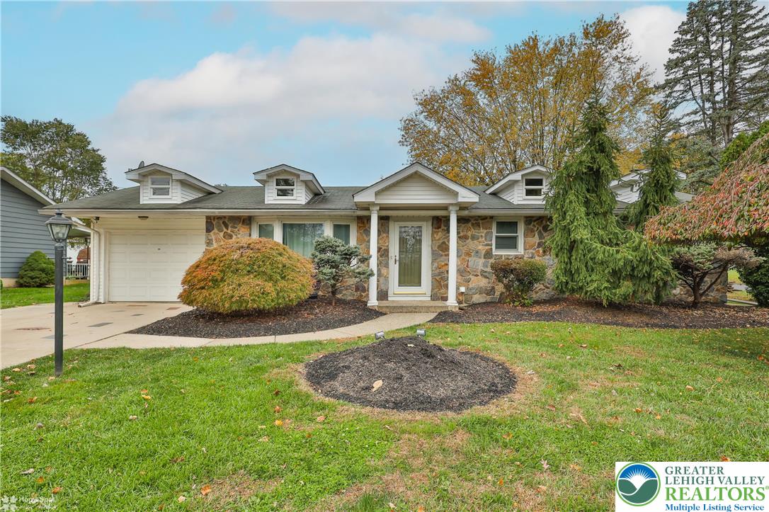 900 Mine Lane Road Easton, PA 18045 - Photo 2 of 51 a front view of a house with a yard and garage