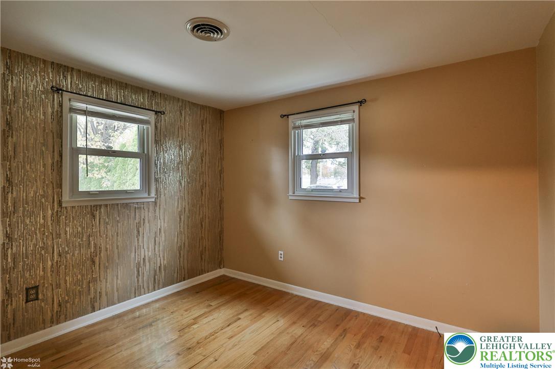 900 Mine Lane Road Easton, PA 18045 - Photo 29 of 51 a view of an empty room with wooden floor and a window