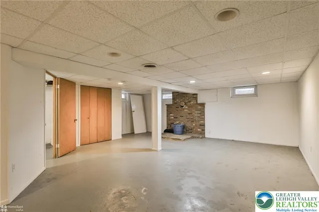 a view of an empty room and a window