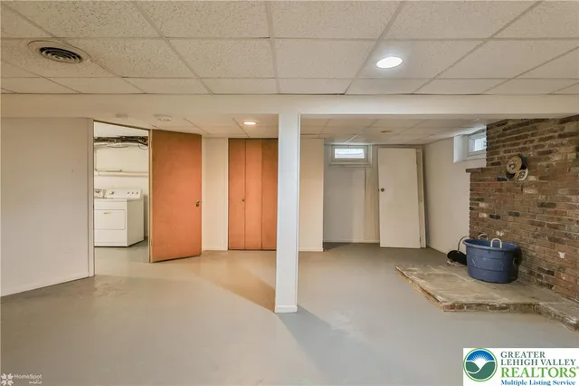 a view of an empty room and a window