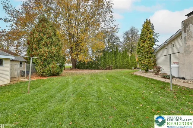 a house view with a backyard space