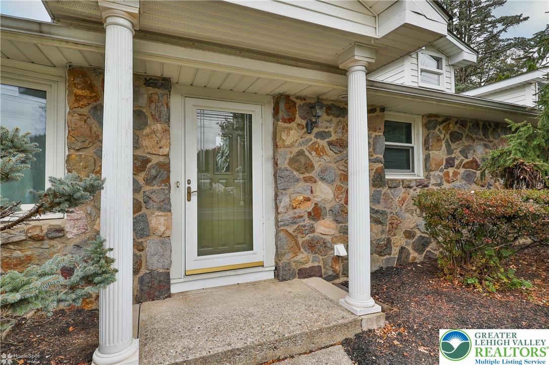 900 Mine Lane Road Easton, PA 18045 - Photo 4 of 51 a view of a brick house with large windows
