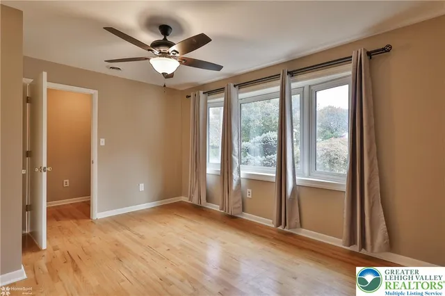 a view of an empty room with a window