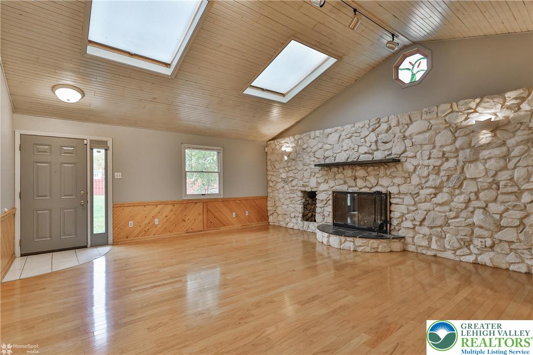900 Mine Lane Road Easton, PA 18045 - Photo 9 of 51 a view of empty room with wooden floor and fireplace