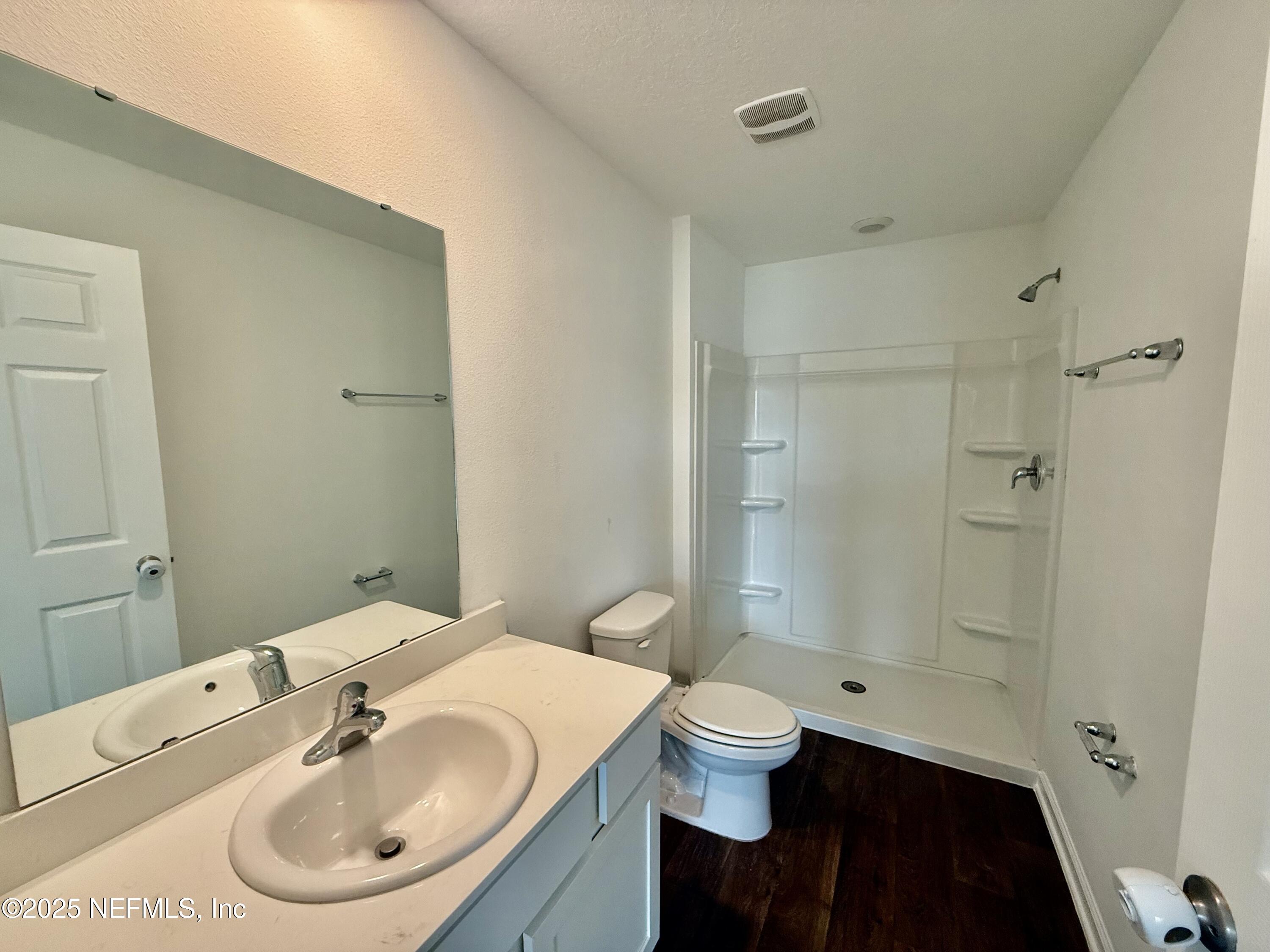 3523 Prairie Wind Court Middleburg, FL 32068 - Photo 7 of 13 a bathroom with a sink toilet and shower