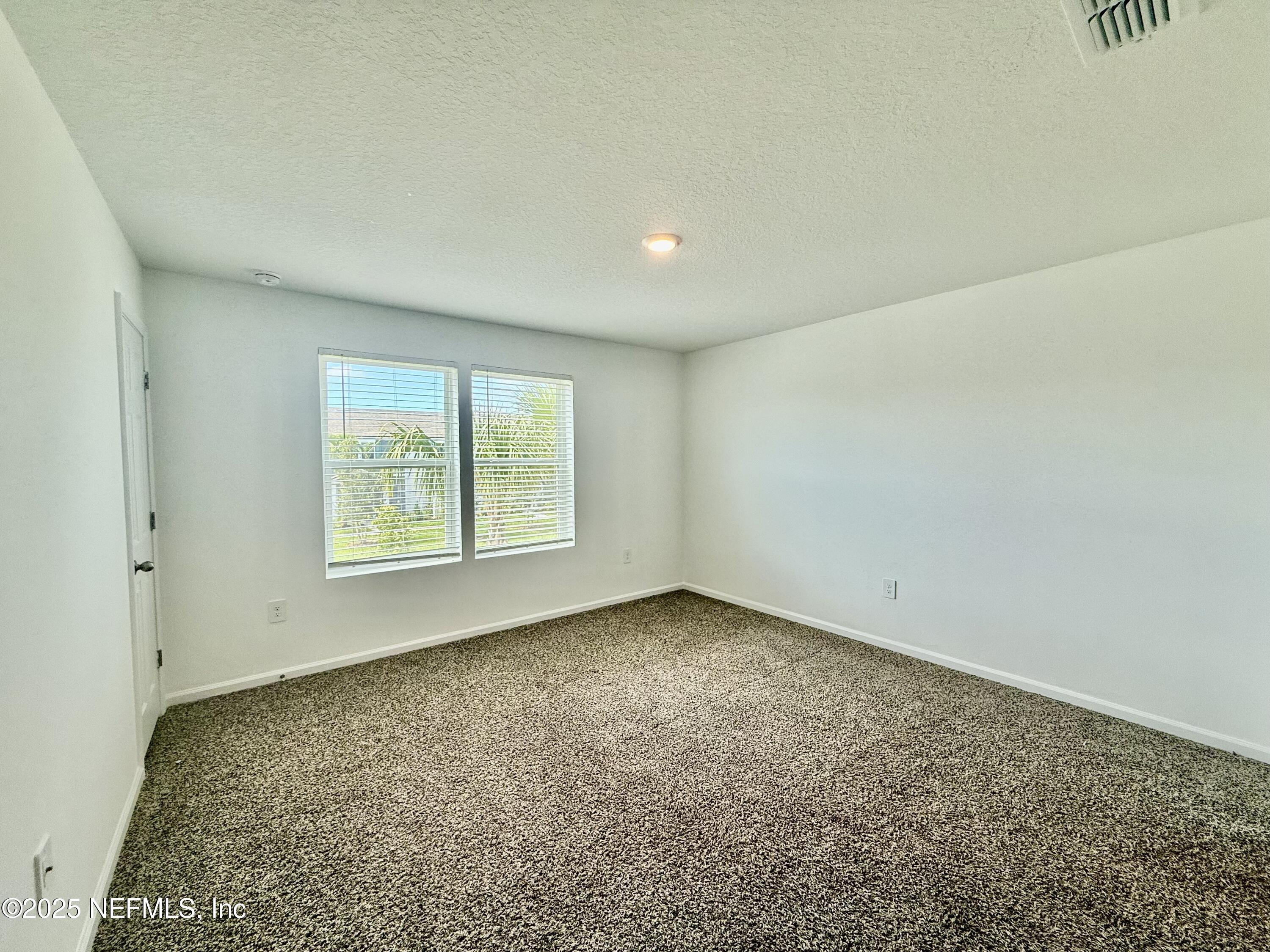 3523 Prairie Wind Court Middleburg, FL 32068 - Photo 8 of 13 an empty room with a window