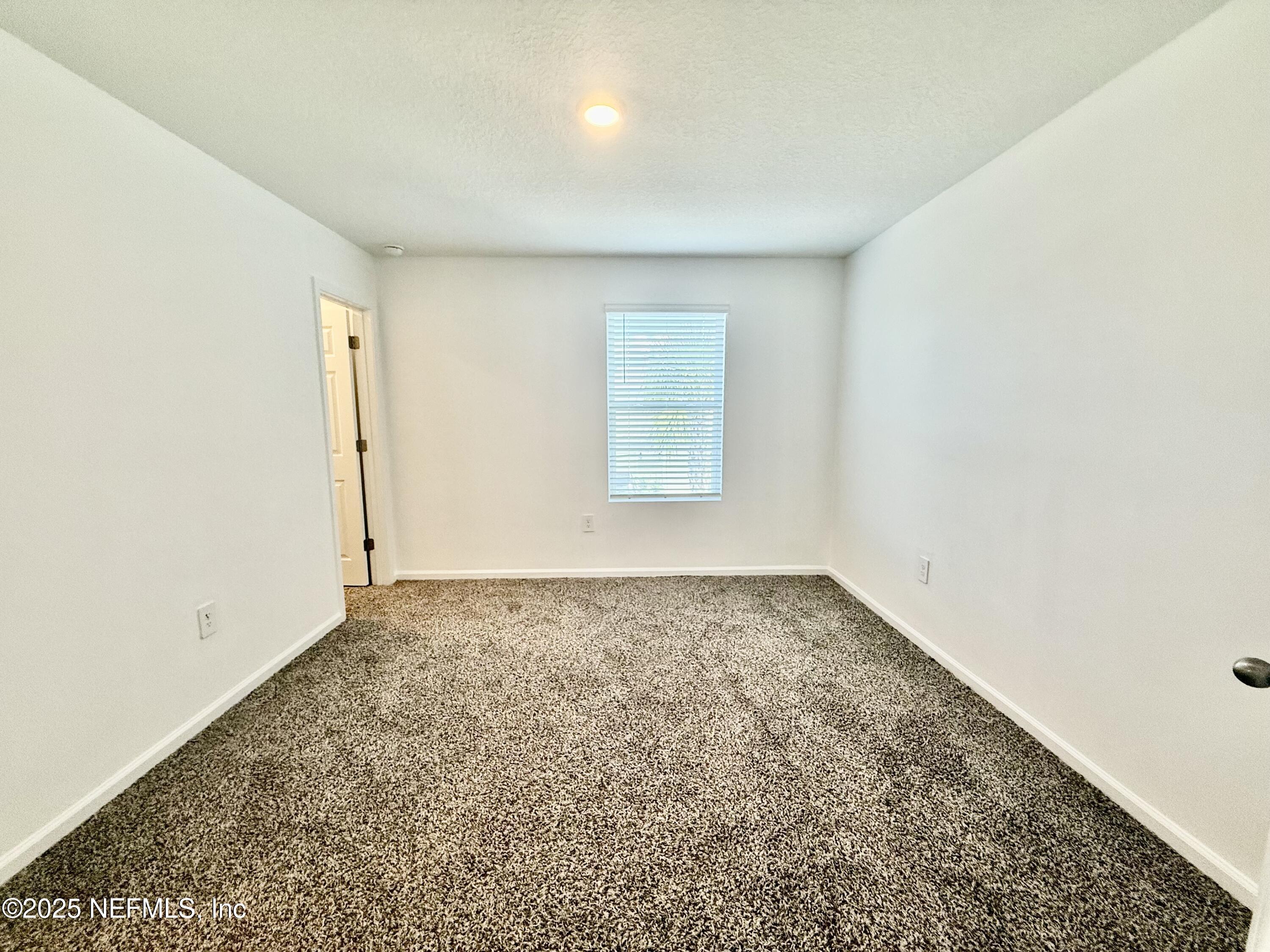 3523 Prairie Wind Court Middleburg, FL 32068 - Photo 9 of 13 an empty room with a window