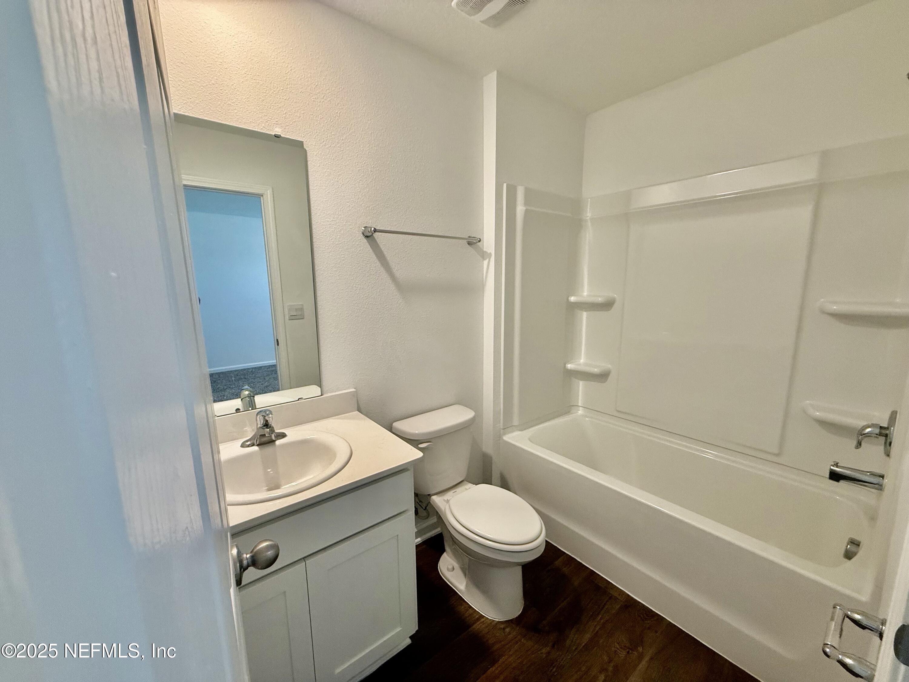 3523 Prairie Wind Court Middleburg, FL 32068 - Photo 10 of 13 a bathroom with a sink toilet and shower