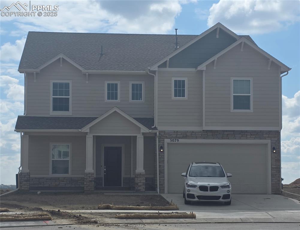 5079 Ruffner Court Colorado Springs, CO 80925 - Photo 1 of 1 a front view of a house with cars parked