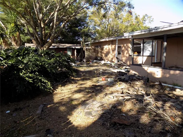 a view of a house with a tree